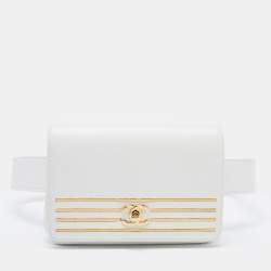 A COLVERT OSTRICH KELLY POCHETTE WITH GOLD HARDWARE