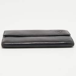 Chanel Black Camellia Embossed Leather Flap Wallet