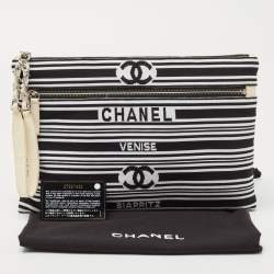 Pre Owned Chanel Black/White Stripe Fabric and Leather Zip Wristlet Clutch
