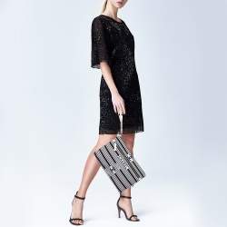 Pre Owned Chanel Black/White Stripe Fabric and Leather Zip Wristlet Clutch