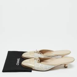 Pre Owned Chanel Gold/White Canvas and Leather CC Cap Toe Mules Size 38.5
