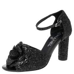 مملوكة مسبقًا صندل شانيل سير كاحل كاميليا غليتر أسود مقاس 38