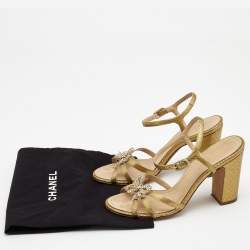 Pre Owned Chanel Gold Textured Leather Crystal Embellished Bow Ankle Strap Sandals Size 37.5