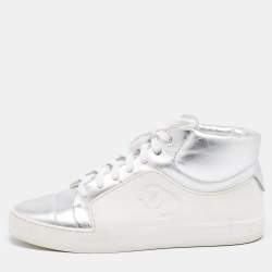 Chanel x pharrell on sale white canvas sneaker