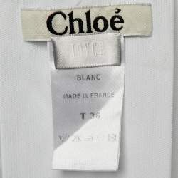 مملوكة مسبقًا بلوزة كلوي قطن أبيض مع تفاصيل زر الخرز مقاس صغير