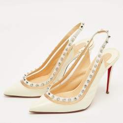 مملوكة مسبقًا حذاء كعب عالي كريستيان لوبوتان بريجاندي سبايك جلد لامع كريمي وبي في سي رباط خلفي مقاس 36.5