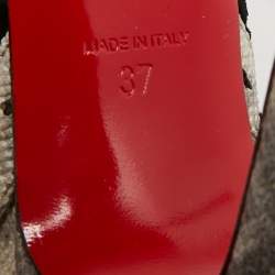 مملوكة مسبقًا بوت كريستيان لوبوتان آتينشن 100 جلد ثعبان البحر بيج بشبكة سوداء مقاس 38.5