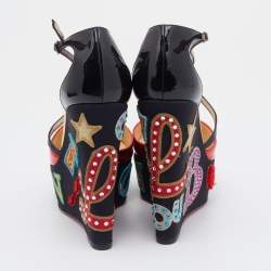 مملوكة مسبقًا صندل كريستيان لوبوتان لوبي زيبا جلد وجلد لامع أسود / أحمر نعل روكي سيور متقاطعة  مقاس 37.5