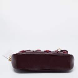 مملوكة مسبقًا Coach Plum Leather Large Floral Applique Pochette