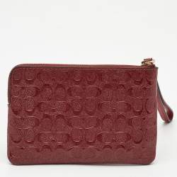 Pre Owned Coach Red Signature Debossed Patent Leather Zip Wristlet Pouch