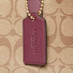 Pre Owned Coach Beige/Purple Signature Coated Canvas and Leather City Tote