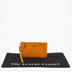 Pre Owned Coach Orange Leather Wristlet Zip Pouch