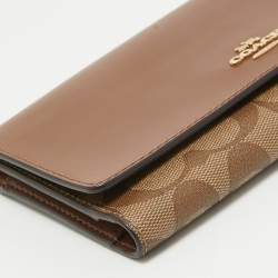 Pre Owned Coach Brown/Beige Signature Coated Canvas and Leather Trifold Long Wallet