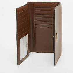 Pre Owned Coach Brown/Beige Signature Coated Canvas and Leather Trifold Long Wallet