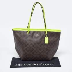 Pre Owned Coach Green/Brown Signature Coated Canvas and Leather Street Zip Tote