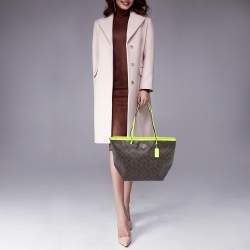 Pre Owned Coach Green/Brown Signature Coated Canvas and Leather Street Zip Tote