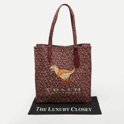 Pre Owned Coach Burgundy/Beige Canvas Rexy Dinosaur Print Shopper Tote