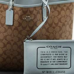 Pre Owned Coach Brown/Light Blue Signature Coated Canvas Reversible City Tote