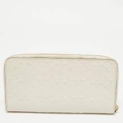 Pre Owned Coach White Signature Embossed Leather Long Zip Around Wallet