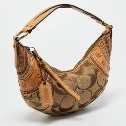 Pre Owned Coach Tan/Beige Signature Canvas and Leather Studded Hobo