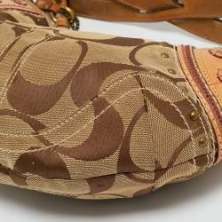 Pre Owned Coach Tan/Beige Signature Canvas and Leather Studded Hobo