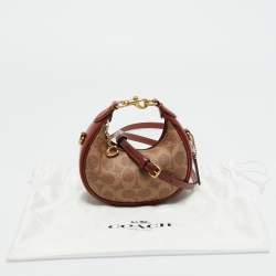 Pre Owned Coach Brown/Beige Signature Coated Canvas Jonie Crossbody Bag