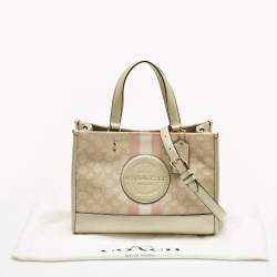 Pre Owned Coach Pale Gold/Beige Signature Jacquard Canvas Dempsey 30 Carryall Tote