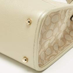 Pre Owned Coach Pale Gold/Beige Signature Jacquard Canvas Dempsey 30 Carryall Tote