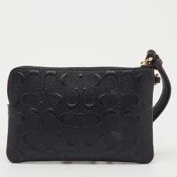 Pre Owned Coach Black Signature Embossed Leather Zip Wristlet
