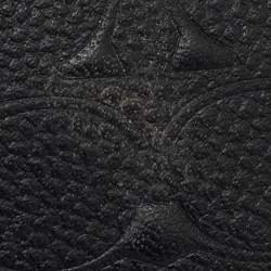 Pre Owned Coach Black Signature Embossed Leather Zip Wristlet