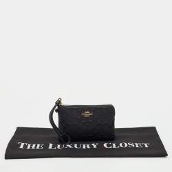 Pre Owned Coach Black Signature Embossed Leather Zip Wristlet