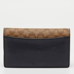 Pre Owned Coach Brown/Beige Signature Coated Canvas and Leather Hayden Foldover Clutch