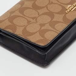 Pre Owned Coach Brown/Beige Signature Coated Canvas and Leather Hayden Foldover Clutch
