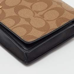 Pre Owned Coach Brown/Beige Signature Coated Canvas and Leather Hayden Foldover Clutch