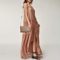 Pre Owned حقيبة كروس بودي كوتش رايلي كانفاس مغلف بالشعار بني