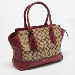 مملوكة مسبقًا حقيبة يد كوتش جلد وقماش شهيرة بيج/وردي بشرابة ليجاسي