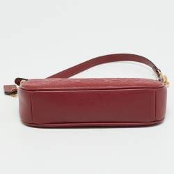 Pre Owned حقيبة صغيرة كوتش نوليتا جلد محفور بتوقيع باللون الأحمر