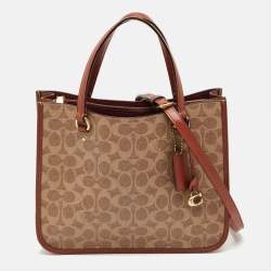 Pre Owned Coach Tyler Carryall Beige/Brown Signature Embossed Leather Tote