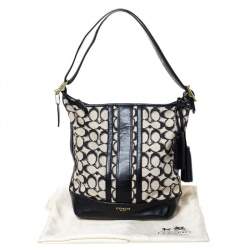 Pre Owned Coach Black/White Signature Canvas and Leather Tassel Hobo