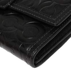 Pre Owned Coach Black Signature Embossed Leather Flap Wallet