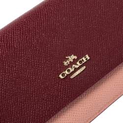 Pre Owned Coach Peach/Maroon Leather Flap Continental Wallet 