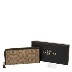 Pre Owned Coach Beige/Brown Signature Canvas and Leather Zip Around Wallet