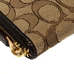 Pre Owned Coach Beige/Brown Signature Canvas and Leather Zip Around Wallet