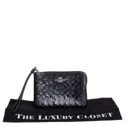 Pre Owned Coach Black Signature Debossed Patent Leather Wristlet Pouch