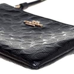 Pre Owned Coach Black Signature Debossed Patent Leather Wristlet Pouch