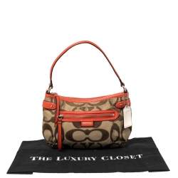 Pre Owned Coach Beige/Orange Signature Canvas and Leather Daisy Hobo