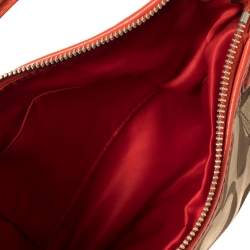 Pre Owned Coach Beige/Orange Signature Canvas and Leather Daisy Hobo