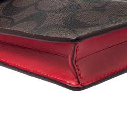 Pre Owned Coach Brown Signature Coated Canvas and Leather Cherry Detail Phone Crossbody Pouch