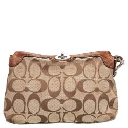 Pre Owned حقيبة كوتش كانفاس بالشعار وجلد بنية بقفل دوار وحمالة م عصم 