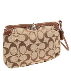 Pre Owned Coach Brown/Beige Signature Canvas and Leather Turnlock Wristlet Pouch